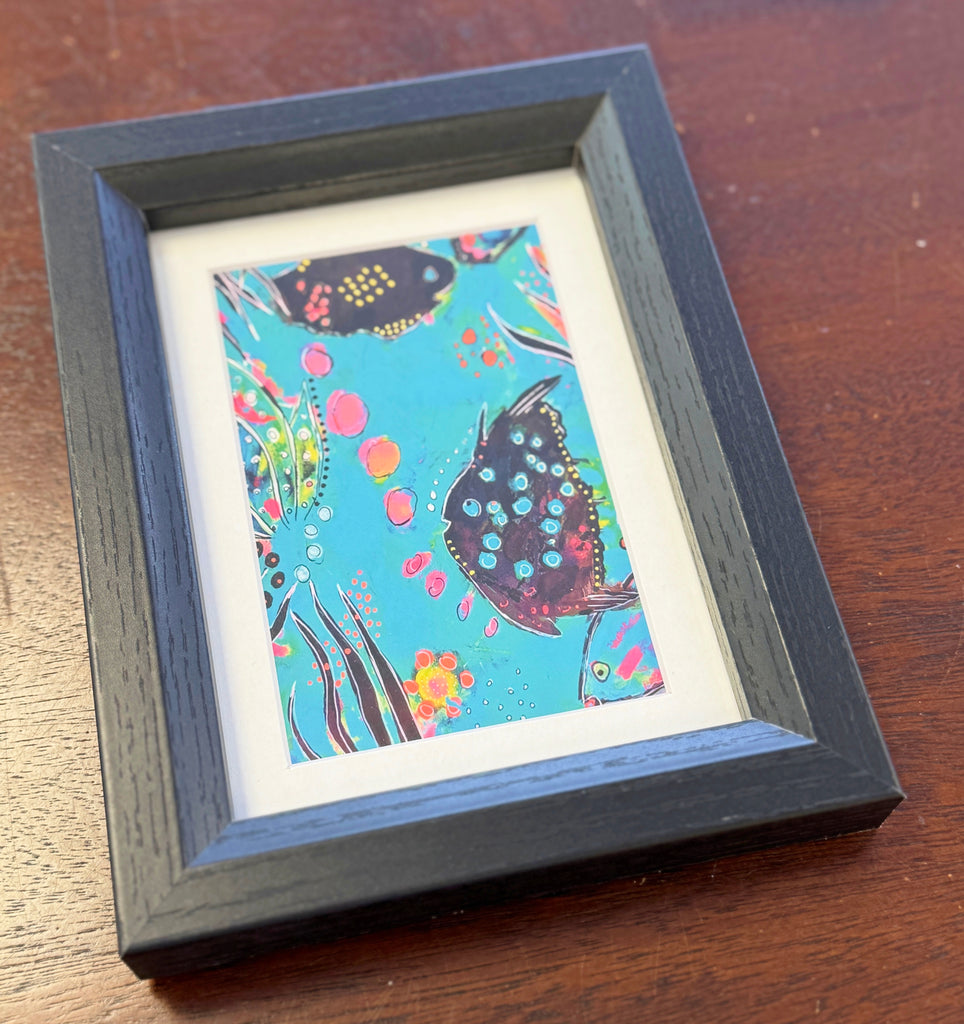 black frame with fish art print