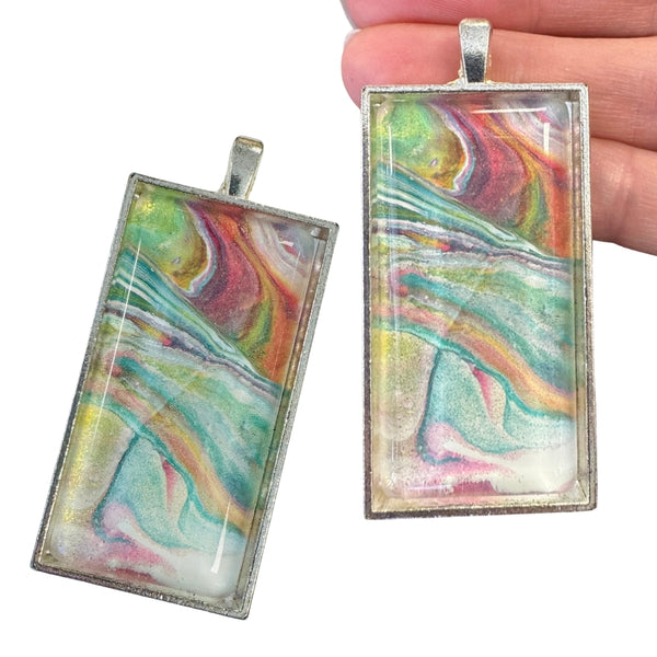 painted glass pendant in silver tray setting