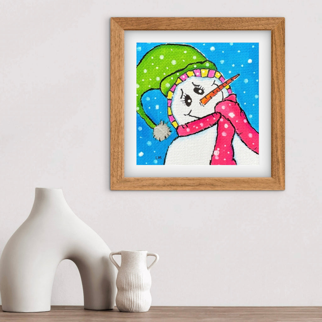 Framed artwork of a colorful snowman on a white wall with two white vases below.