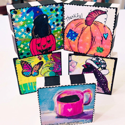 colorful painted art desk sitters at Lori McKinnon Art studio