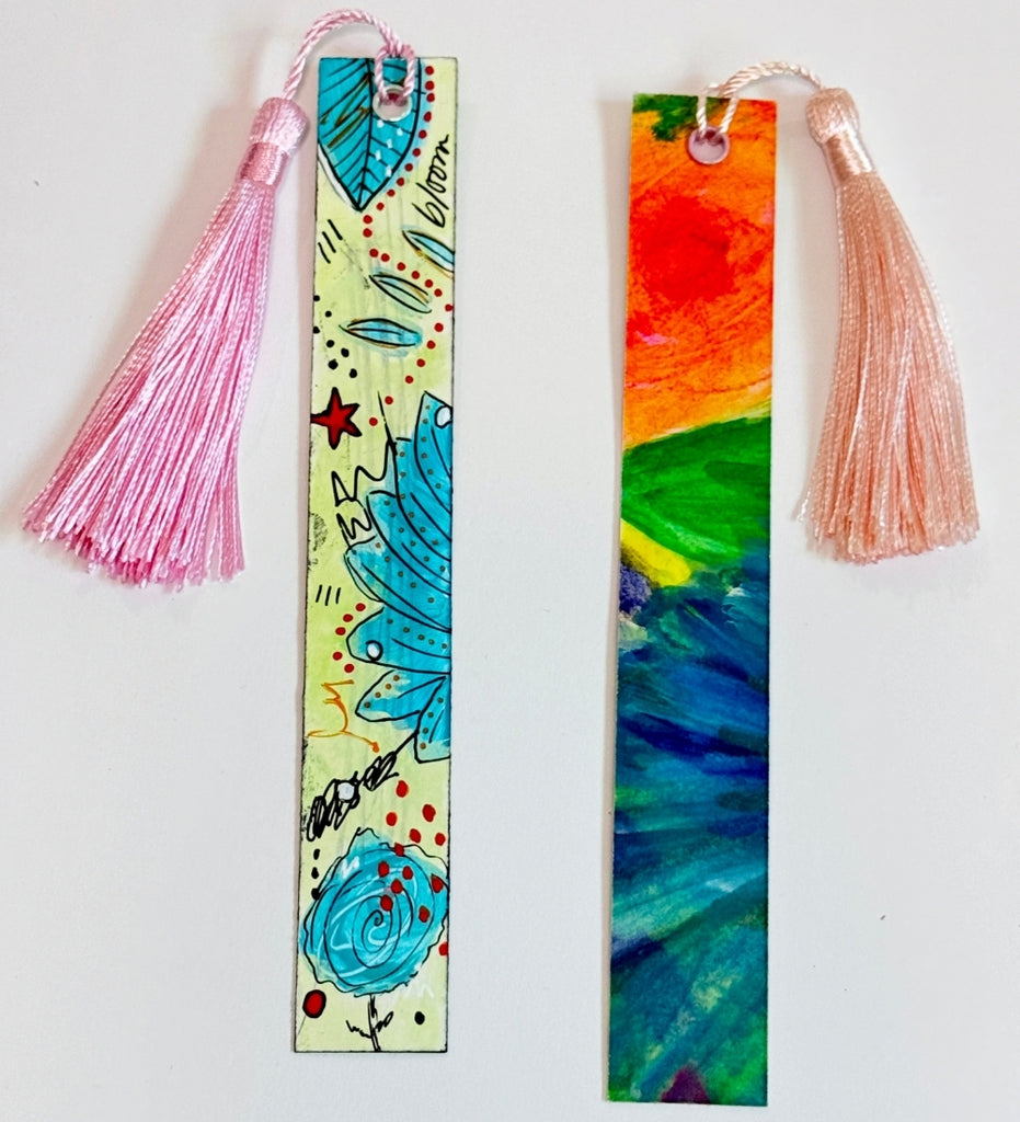 two hand painted tassel bookmarks with colorful artwork
