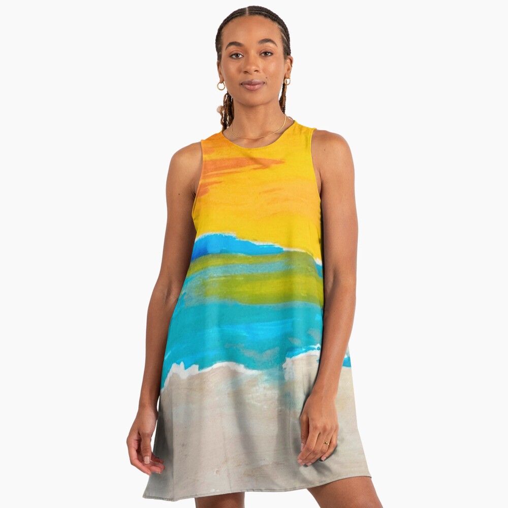 Woman wearing a sleeveless dress with a colorful design on a white background
