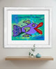 Framed colorful fish painting on a wall above a wooden shelf.