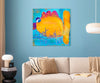 A colorful painting featuring a stylized yellow-orange fish and the phrase 'Don't talk to the bait' in blue script, displayed on a light blue wall above a beige sofa in a modern living room setting.