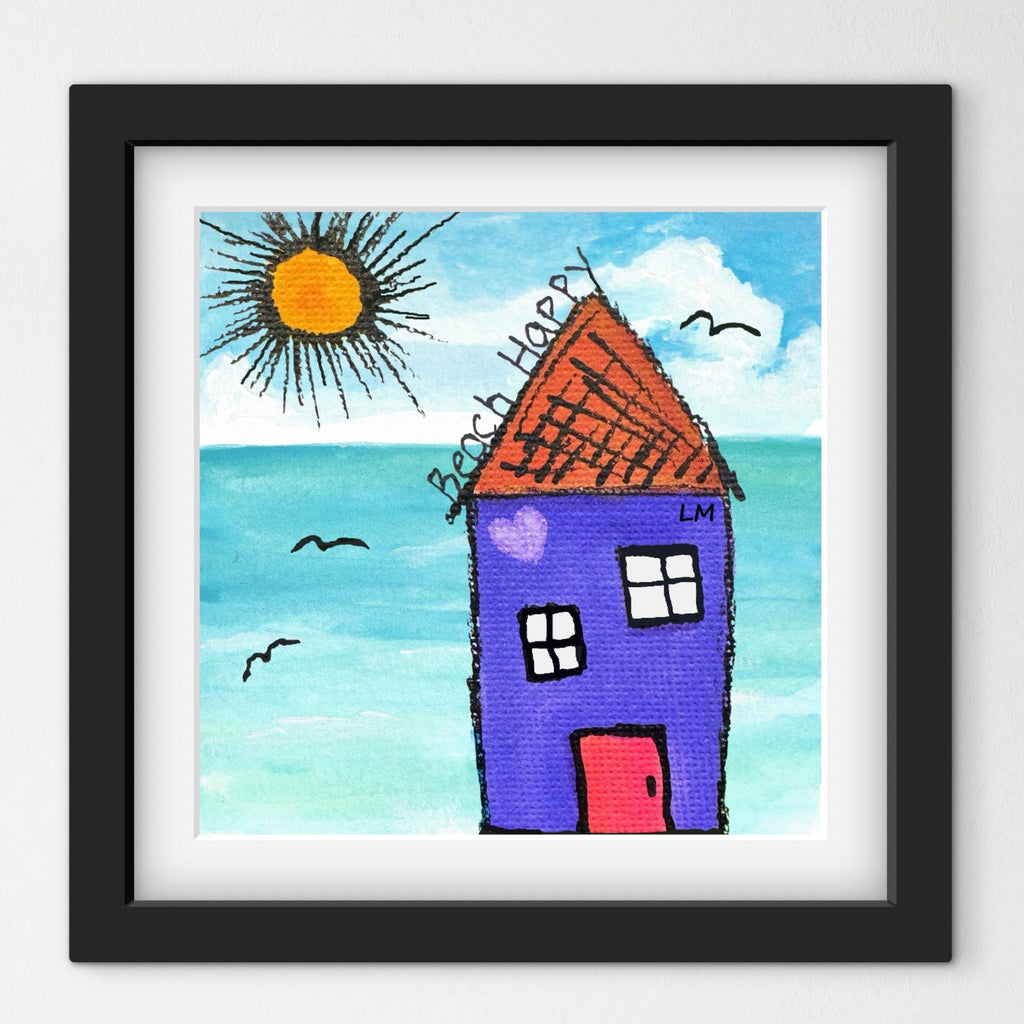 Framed artwork of a colorful house by the sea with a sun and birds.