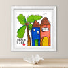 Framed artwork with colorful houses and a palm tree, labeled 'Beach Life', on a neutral wall.
