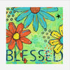 Colorful artwork with flowers and the word 'Blessed' on a green background