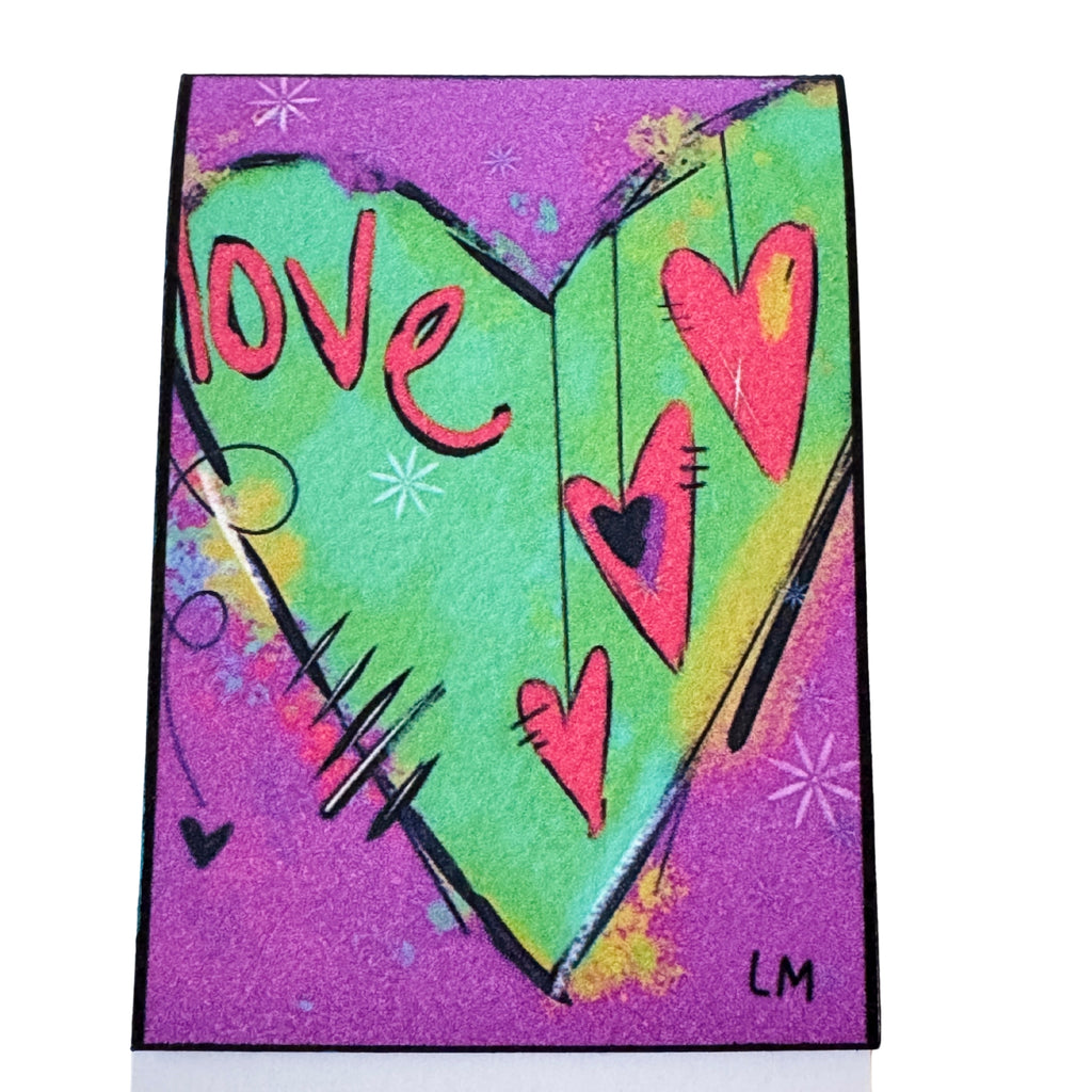rectangular abstract art print featuring a large green heart with pink 'love' lettering and smaller pink hearts, set against a glittery purple background with black and yellow accents.