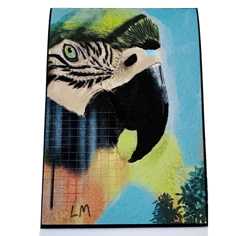 an art bookmark featuring a stylized close-up of a parrot head with bright blue, green, yellow, black, and orange tones, shown against a plain white background.