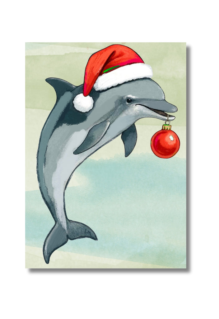 Dolphin wearing a Santa hat and holding a Christmas ornament on a light green background