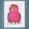 Framed artwork of a pink bird with a motivational quote in a white frame