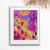 Colorful abstract art print with flowers and abstract shapes in a white frame.