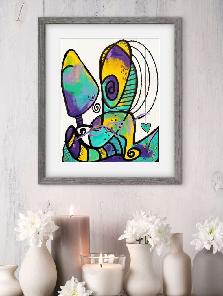 Framed abstract artwork on a white wall with decorative vases and candles.