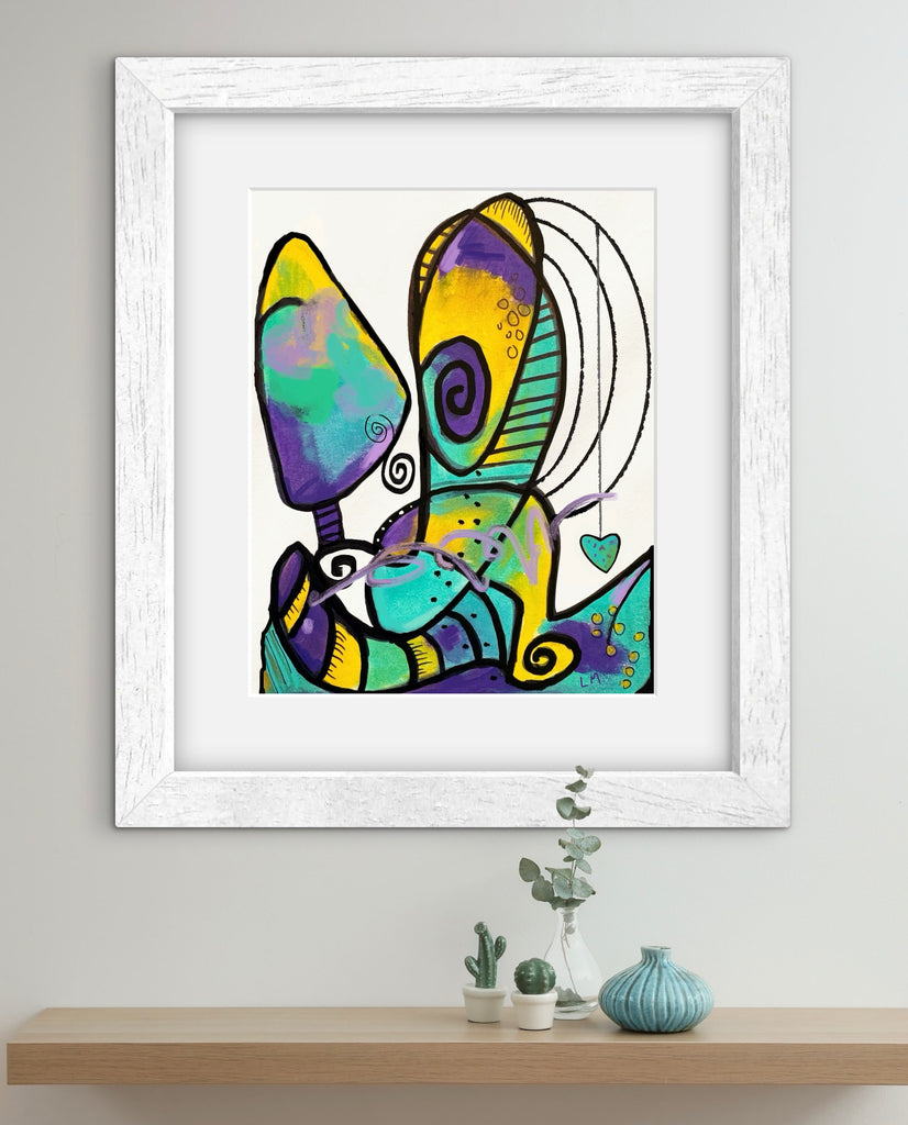 Framed abstract artwork on a wall above a shelf with decorative items.