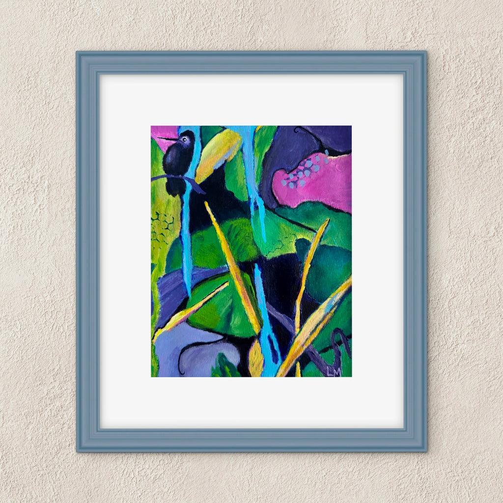 A framed abstract painting featuring vibrant green, blue, pink, and yellow brushstrokes, set in a slate blue frame with a white mat against a textured beige wall