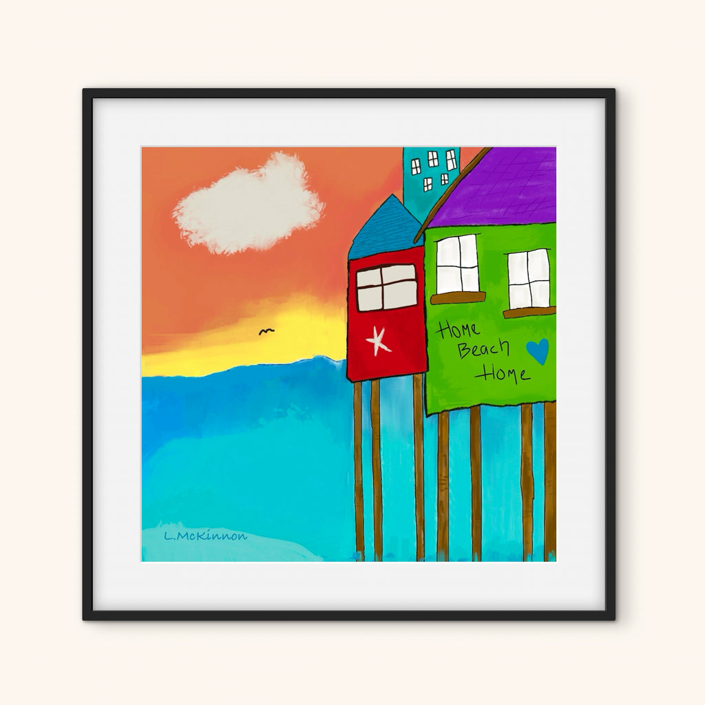 whimsical beach art in black frame on a white wall