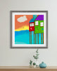 beach house artwork in gray frame with desk below