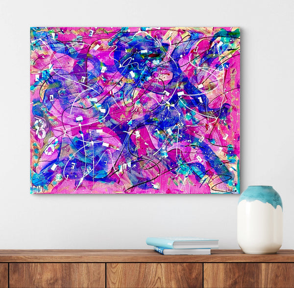 Abstract colorful painting on a white wall with a wooden shelf below.