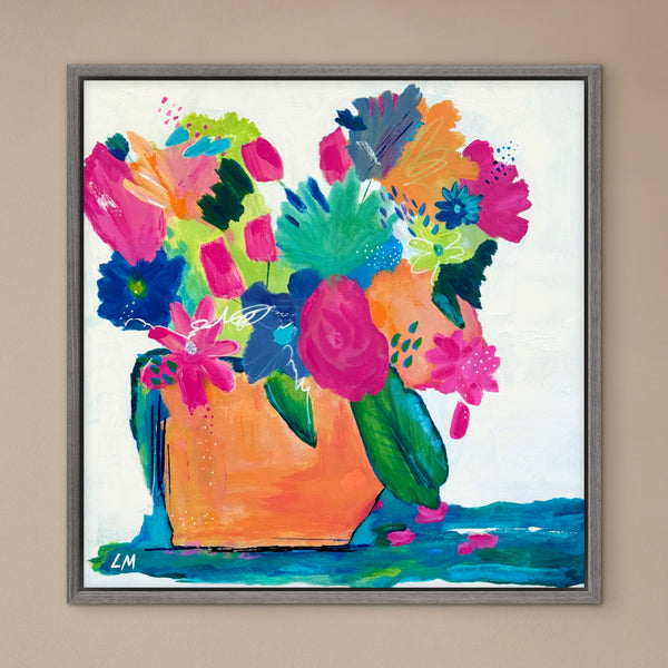 Colorful floral painting with a vase on a beige wall