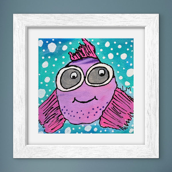 Framed artwork of a purple fish with goggles on a blue polka dot background.