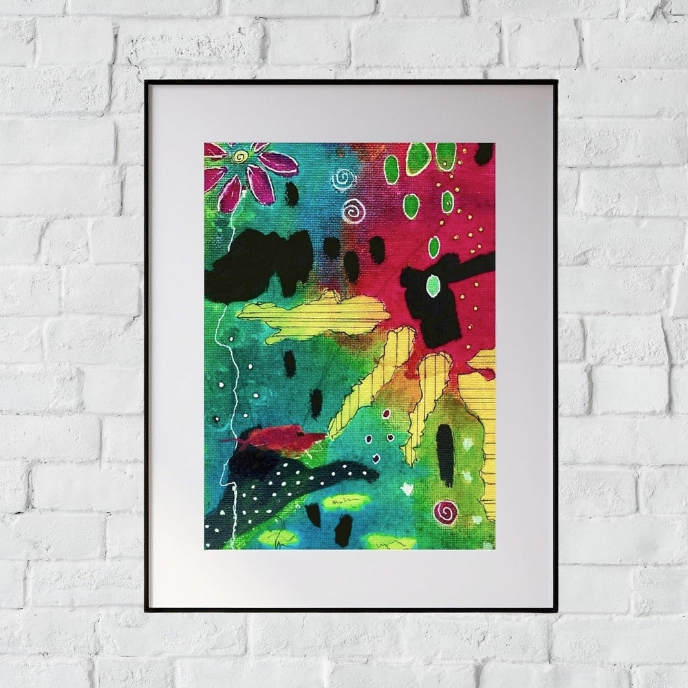 colorful abstract painting in a frame with a white mat hanging on a white brick wall