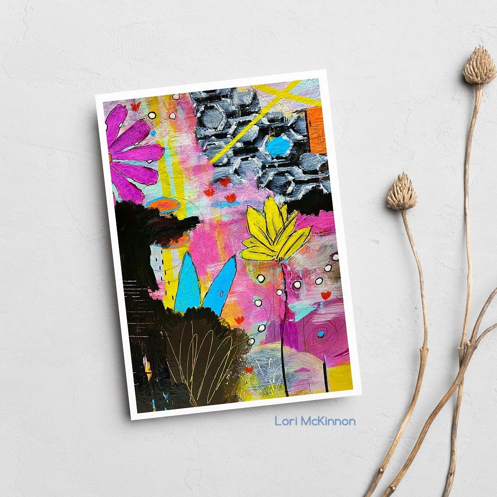 Colorful abstract art print by Lori McKinnon on a light gray background with dried plants.