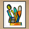 Framed abstract artwork with colorful shapes on a beige wall