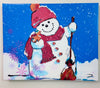 A horizontal canvas print of a whimsical snowman wearing a red knit hat and scarf, holding a broomstick, set against a bright blue snowy background 