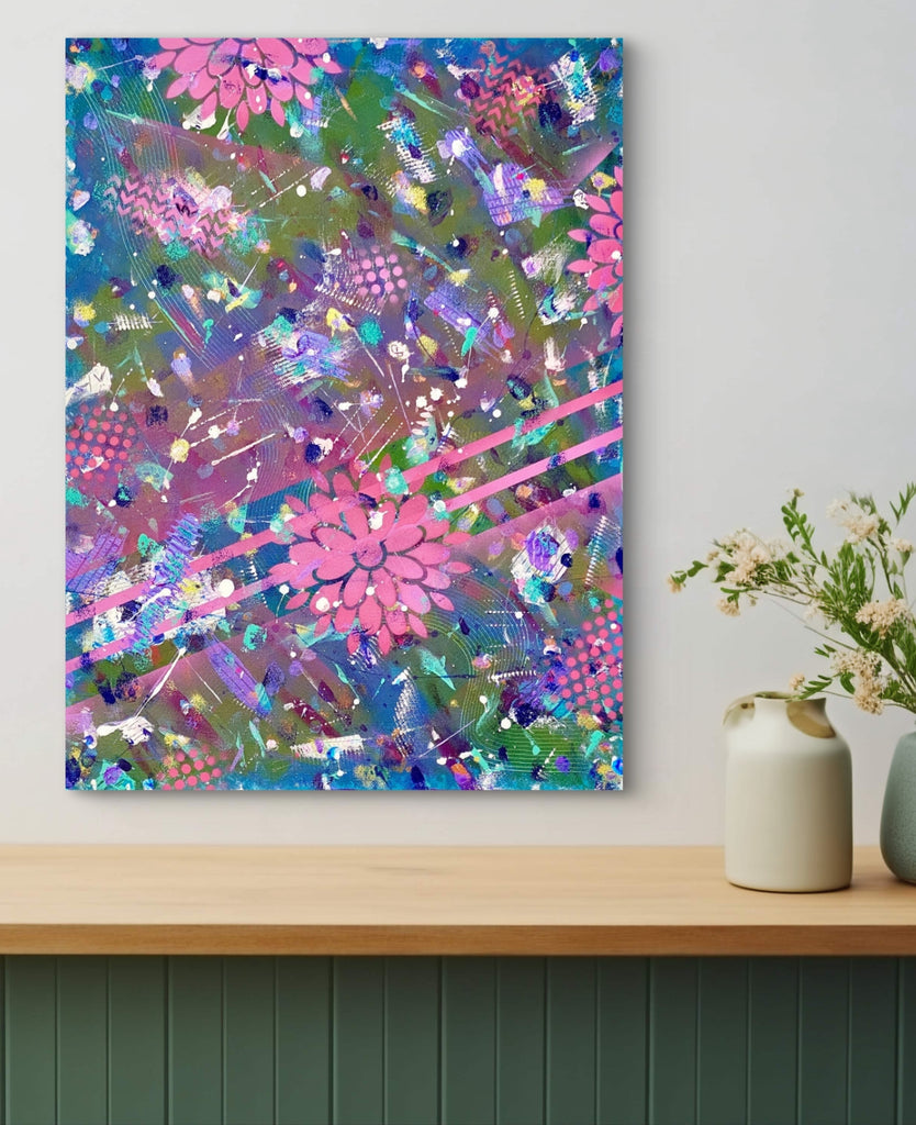 Colorful abstract painting on a wall above a wooden shelf with decorative items.