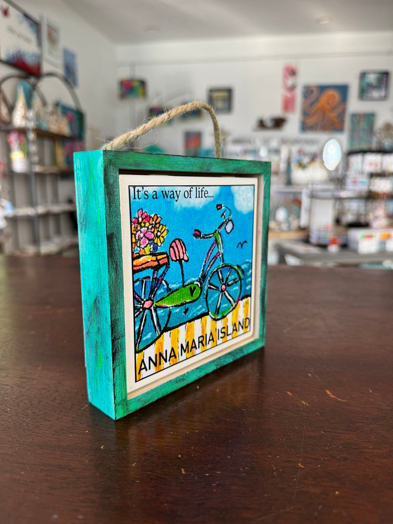 Original art with a bicycle and text 'It's a way of life... Anna Maria Island' in a hand painted 5x5 inch frame.