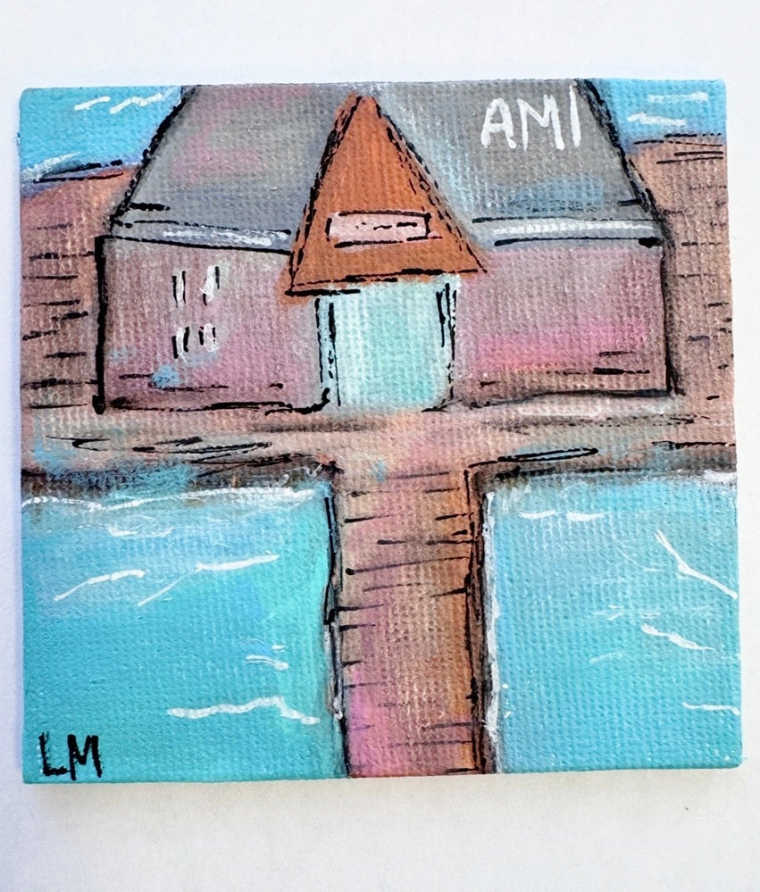 AMI text on a building over water