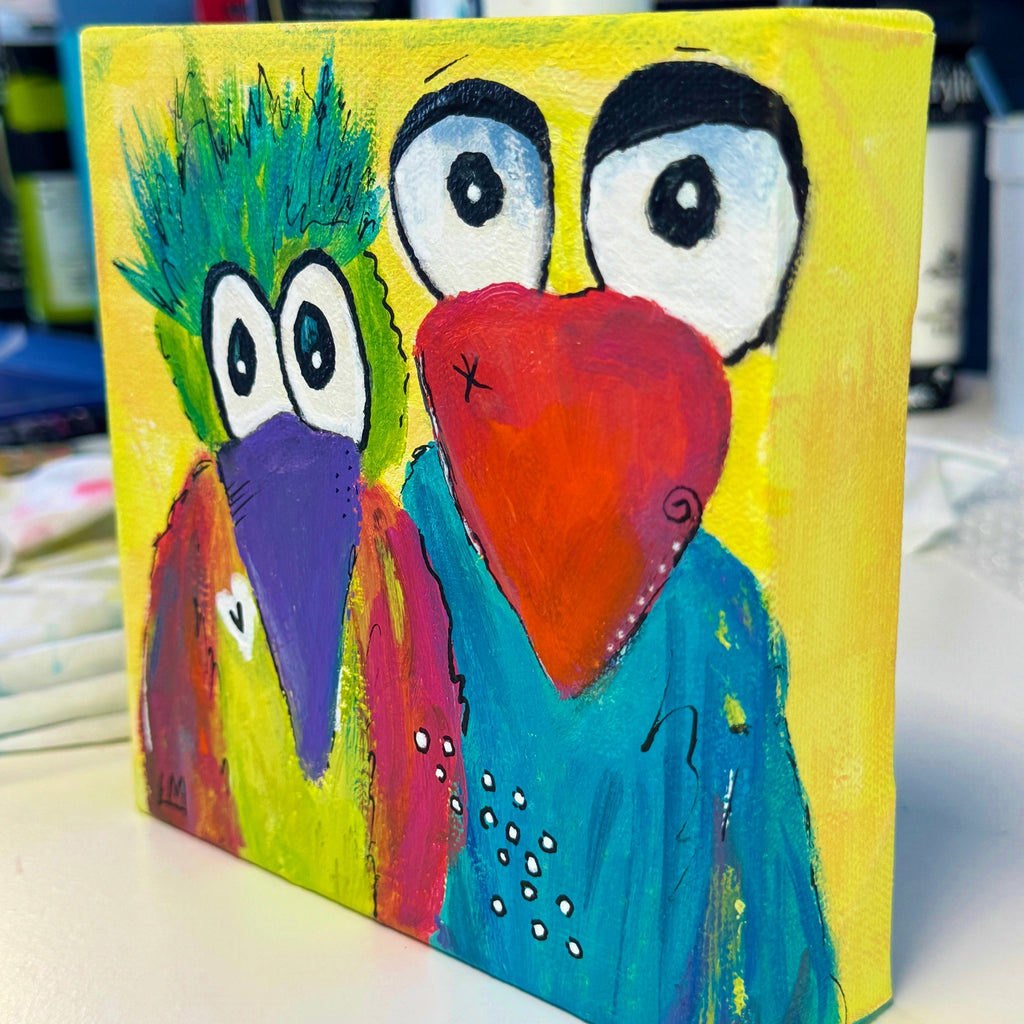 Colorful painting of two whimsical fun loving birds with a yellow background