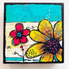 A colorful square floral painting on a white background