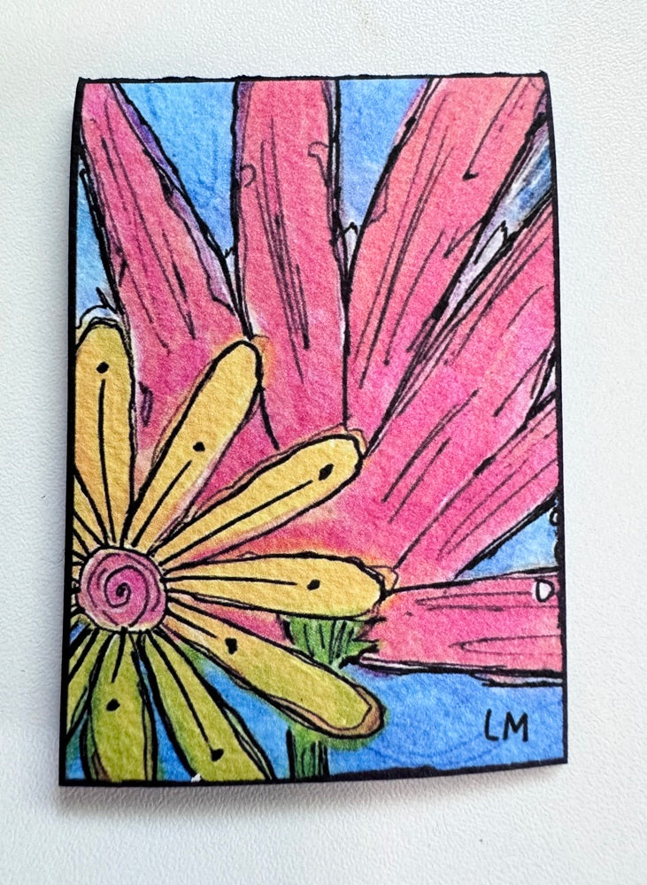 A colorful art print on a white textured background, featuring a stylized flower with yellow petals, a pink center, and large pink leaves against a blue sky. Signed 'LM' in the bottom right corner.