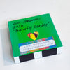 a block painted green with the artist's name and the year '2026'