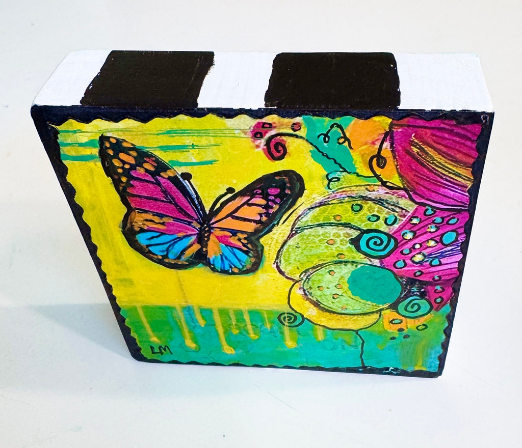 butterfly art painted on a square wooden block