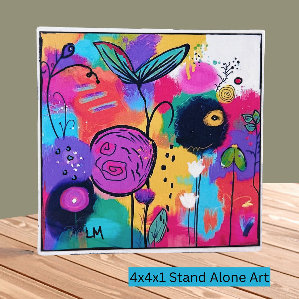 Cheer Up floral art block standing on a wooden tabletop, with colorful abstract flowers and text reading “4x4x1 Stand Alone Art.”
