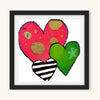 Framed artwork of colorful hearts on a white background