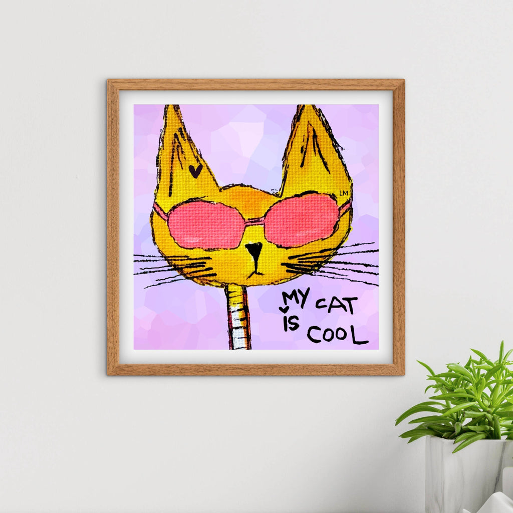 Framed artwork of a cat wearing sunglasses with 'My cat is cool' text on a purple background.