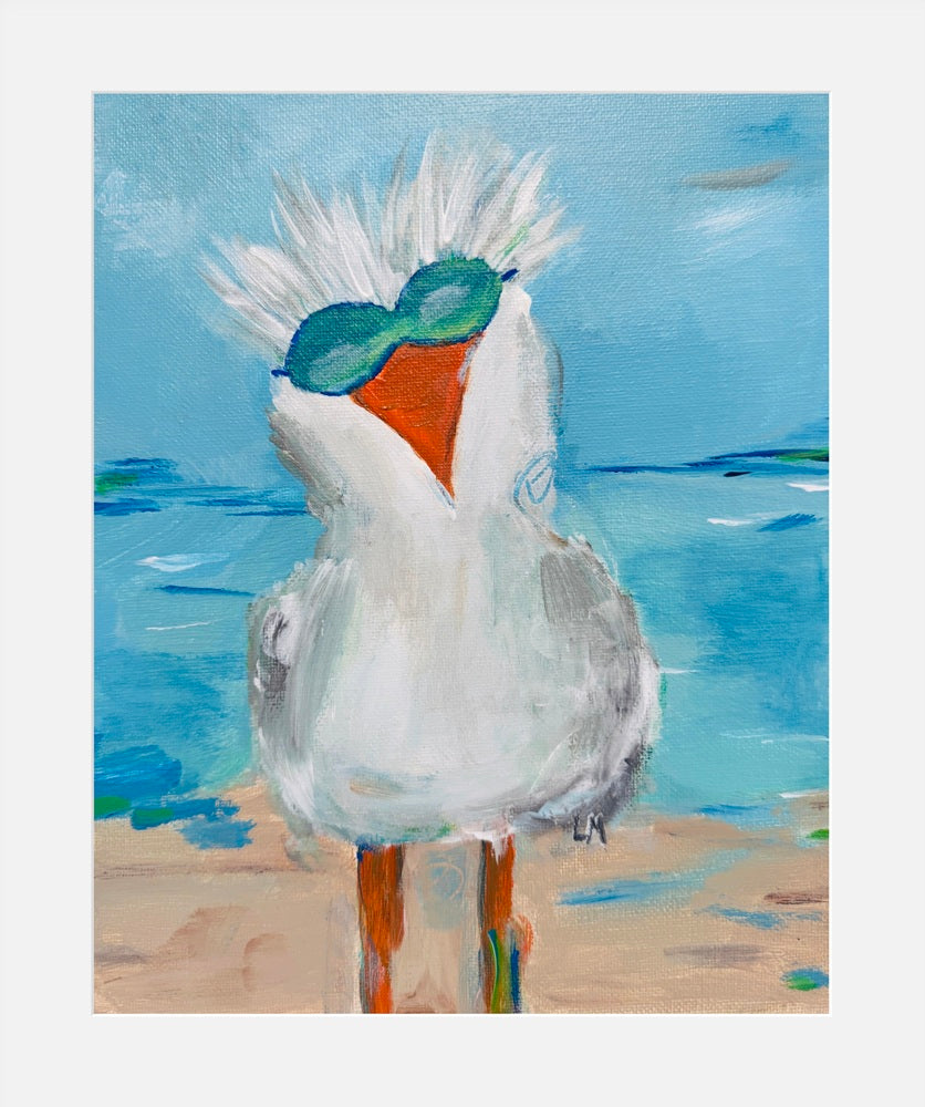 print of seagull on a beach with a blue sky.