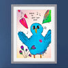 Framed artwork of a blue bird with musical notes and flowers on a blue wall.
