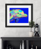 Framed colorful dolphin artwork on a wall above a shelf with decorative items.