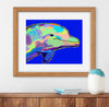 Framed colorful dolphin painting on a wall above a wooden shelf with a vase and books.