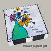 wood block with floral art on it and text 'makes a great gift' is underneath it
