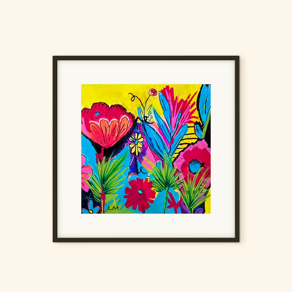 A joyful art print in a black frame with a white mat