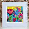 Original acrylic floral painting with pink and red flowers, turquoise leaves, and a bright yellow background, shown in a white mat