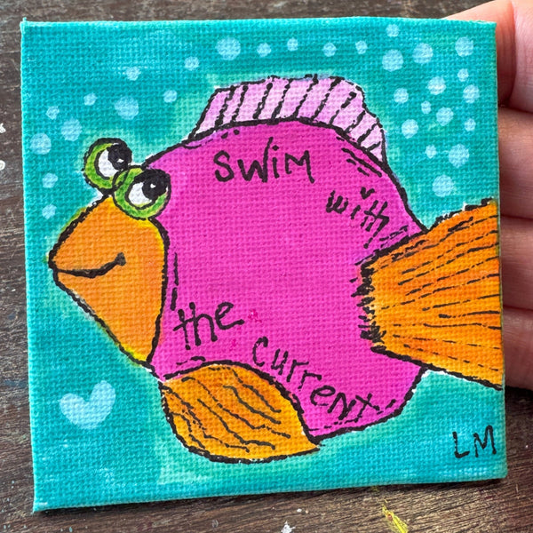 pink fish on a blue background