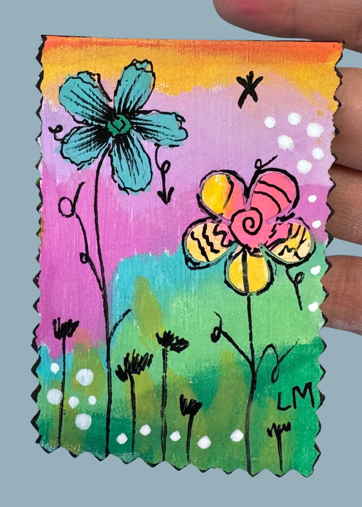 flower painting held in a hand 