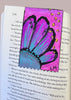 a floral bookmark on a book page