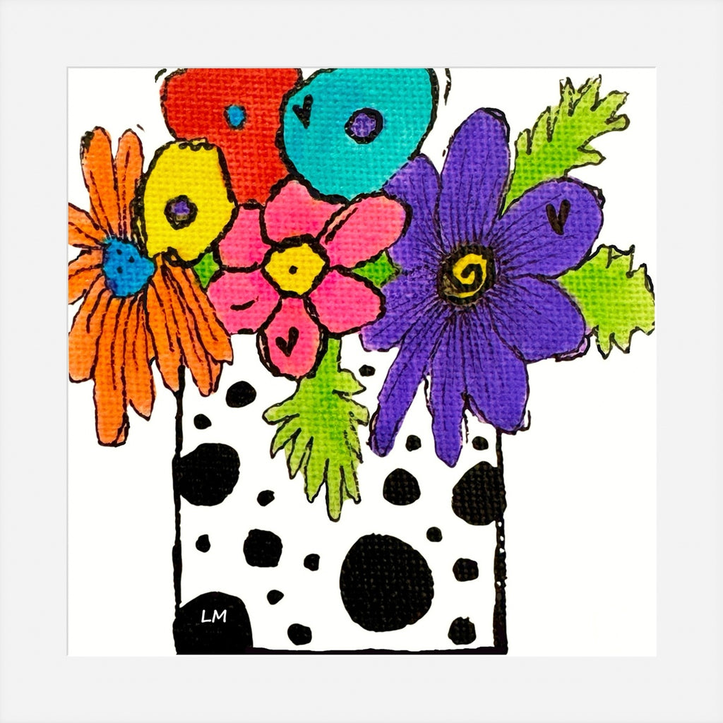 Colorful floral arrangement with a black and white polka dot pattern on a white background